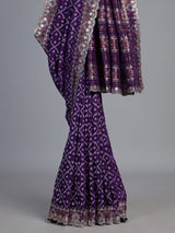 Purple soft silk saree with shimmering ikat printed embellishments