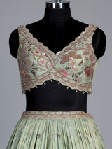 Pista green silk lehenga with zardosi festive detailing