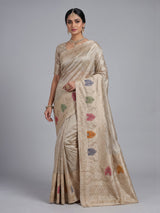 Pastel beige silk saree with delicate traditional embellishments