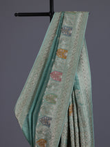 Mint blue silk saree with elegant peacock motif work