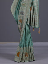 Mint blue silk saree with elegant peacock motif work