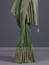 Pista green silk saree with elegant peacock motif embellishments