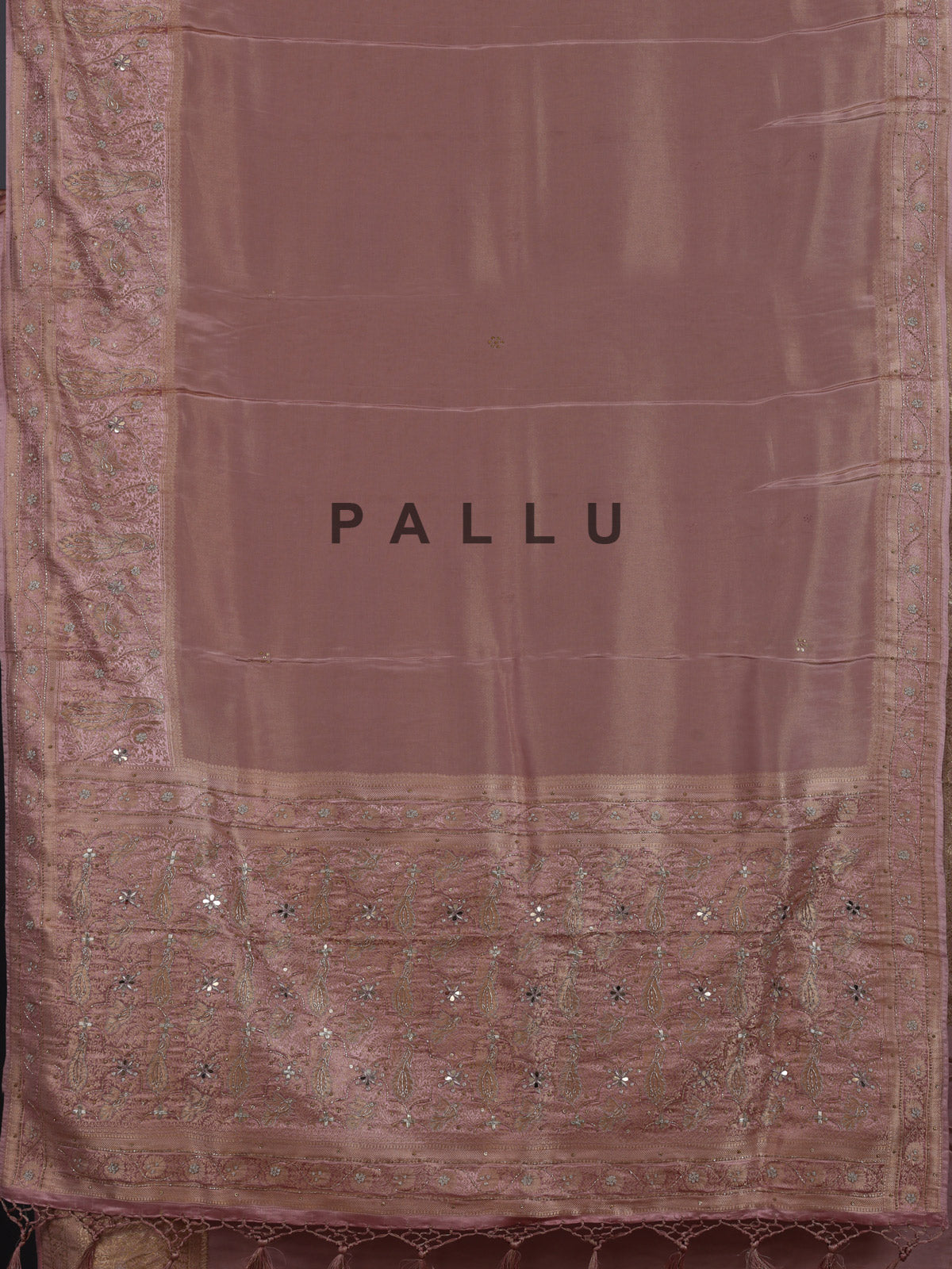 Onion pink silk saree with graceful traditional pallu tassels