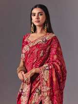 Maroon gharchola silk saree with peacock motif embellishments