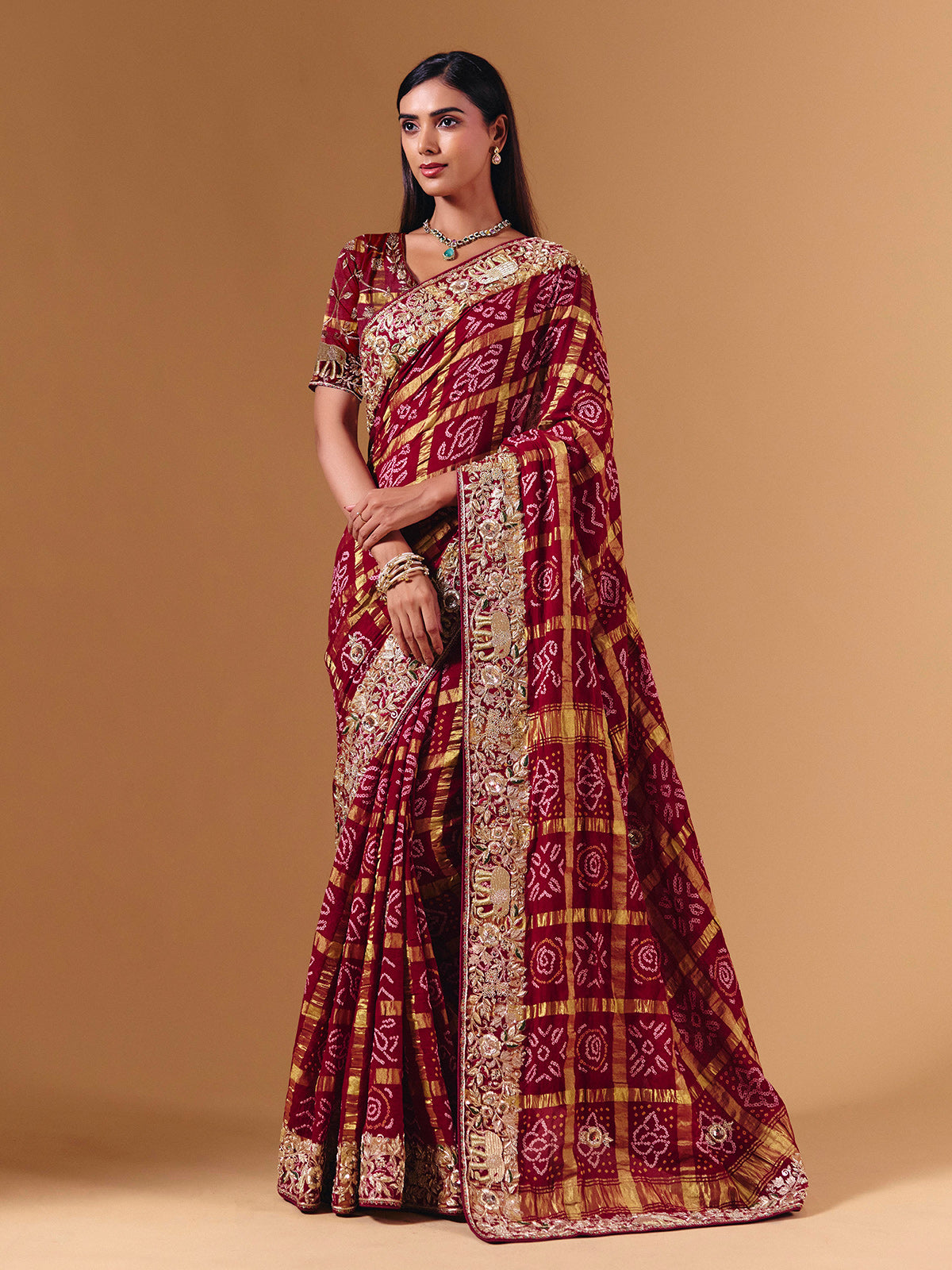 Maroon gharchola silk saree with elephant motif artistry