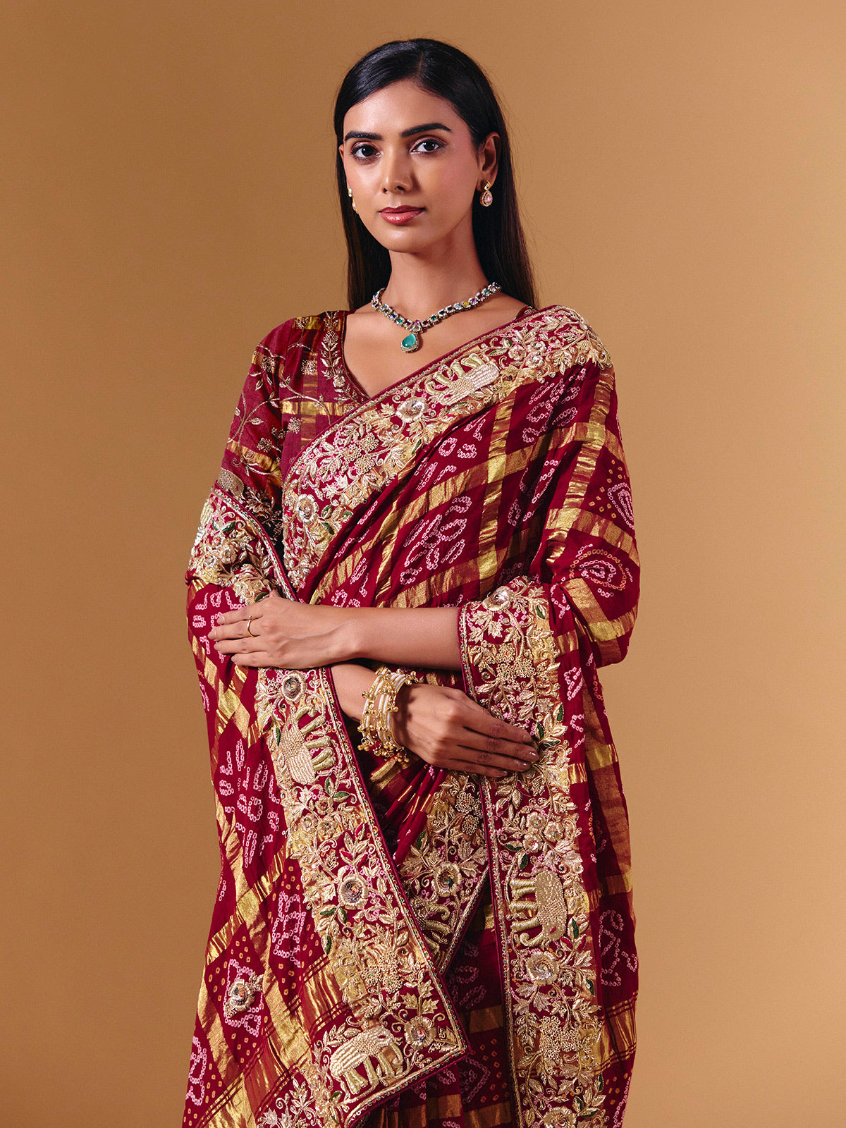 Maroon gharchola silk saree with elephant motif artistry