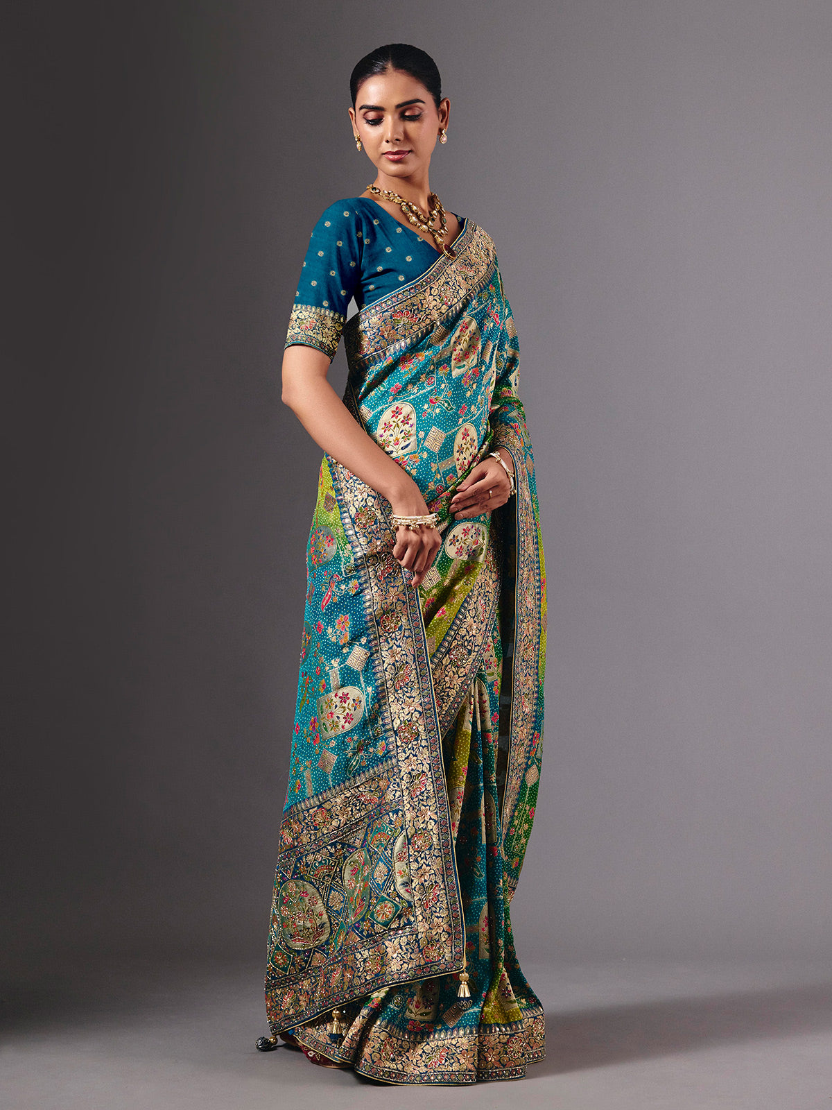 Blue dola silk saree with elegant peacock motif embellishments