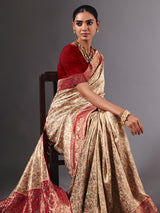 Beige shimmer dola silk saree with floral zari artistry
