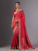 Red modal silk saree with delicate zari tassel detailing