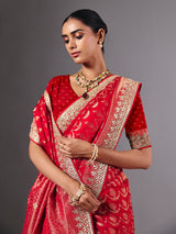 Red modal silk saree with delicate zari tassel detailing