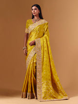 Yellow satin silk saree with elegant mirror zari artistry