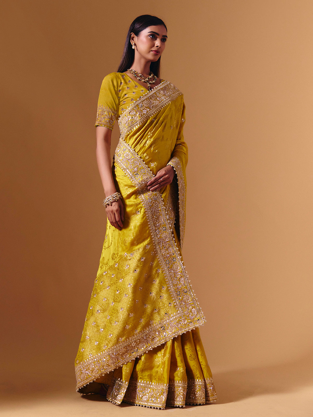 Yellow satin silk saree with elegant mirror zari artistry