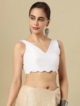 White linen solid blouse with V neck and sleeveless silhouette