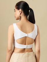 White linen solid blouse with V neck and sleeveless silhouette