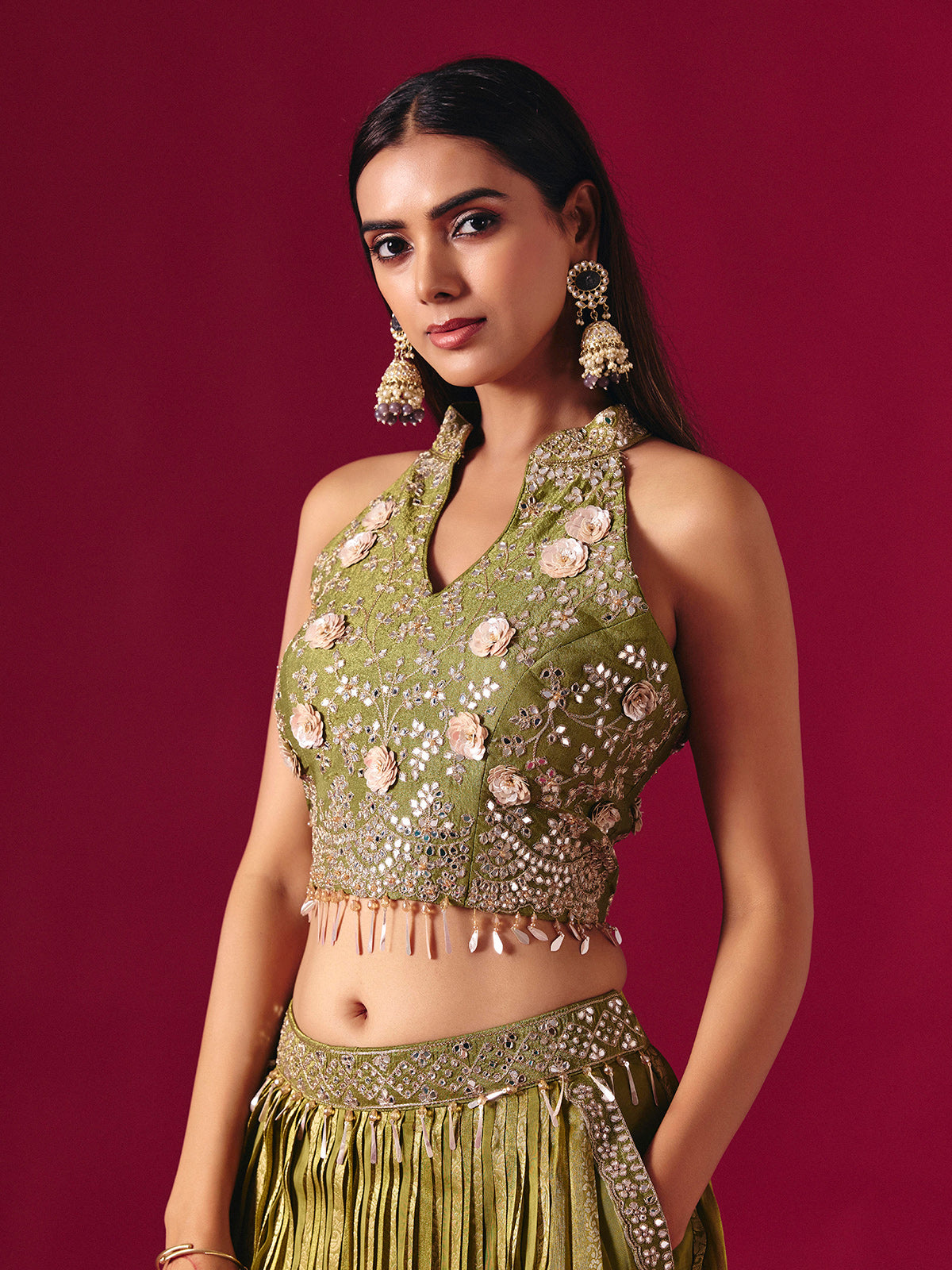 Olive green tissue silk lehenga choli with mirror and zari embellishments