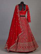 Red silk lehenga choli with exquisite resham and cutdana detailing
