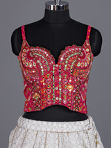 White silk blend lehenga choli with intricate traditional embellishments