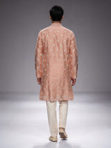 Peach raw silk mens kurta suit with intricate sequin and butti work