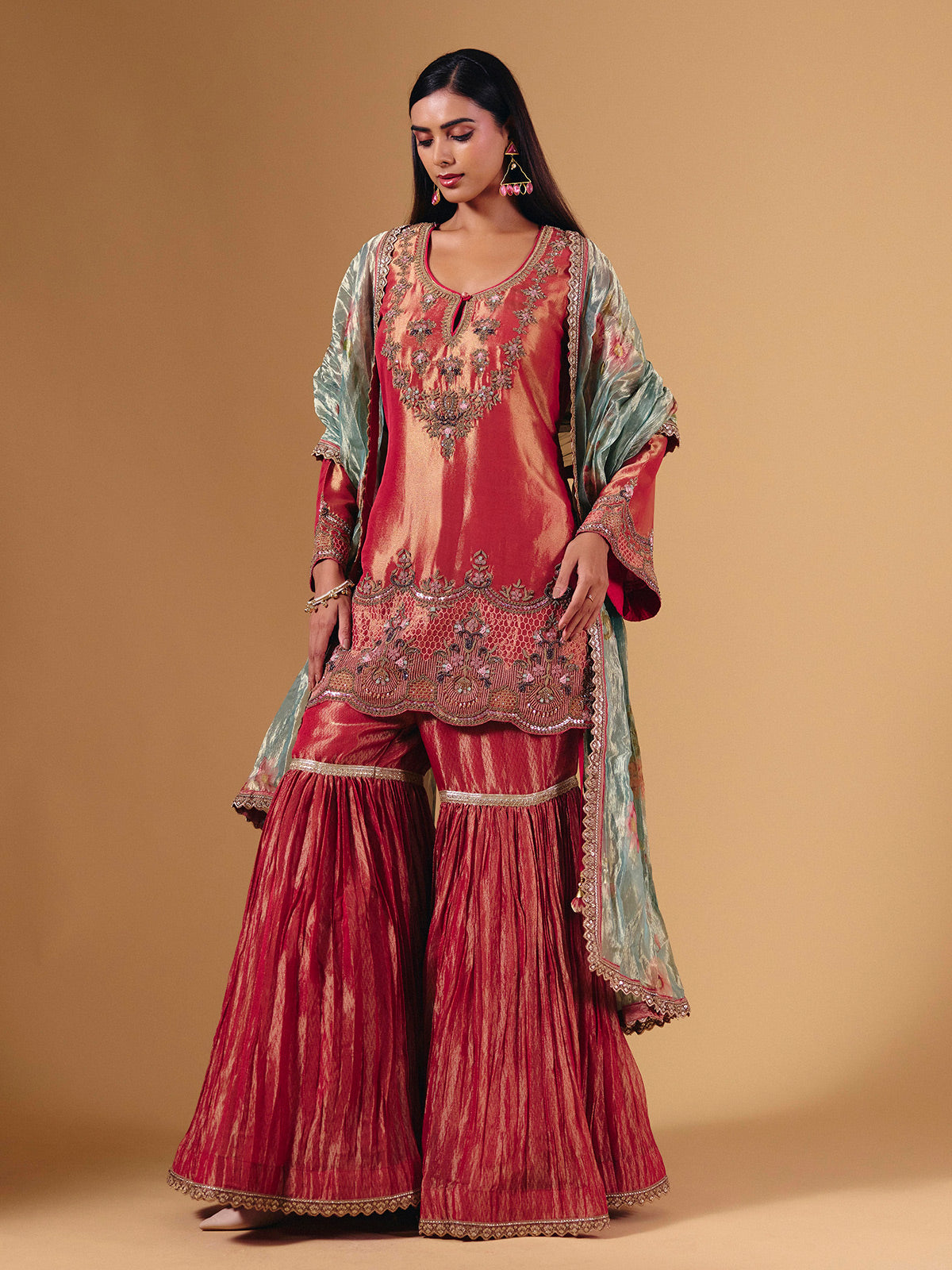 Pastel peach silk sharara suit with cutdana embellishments