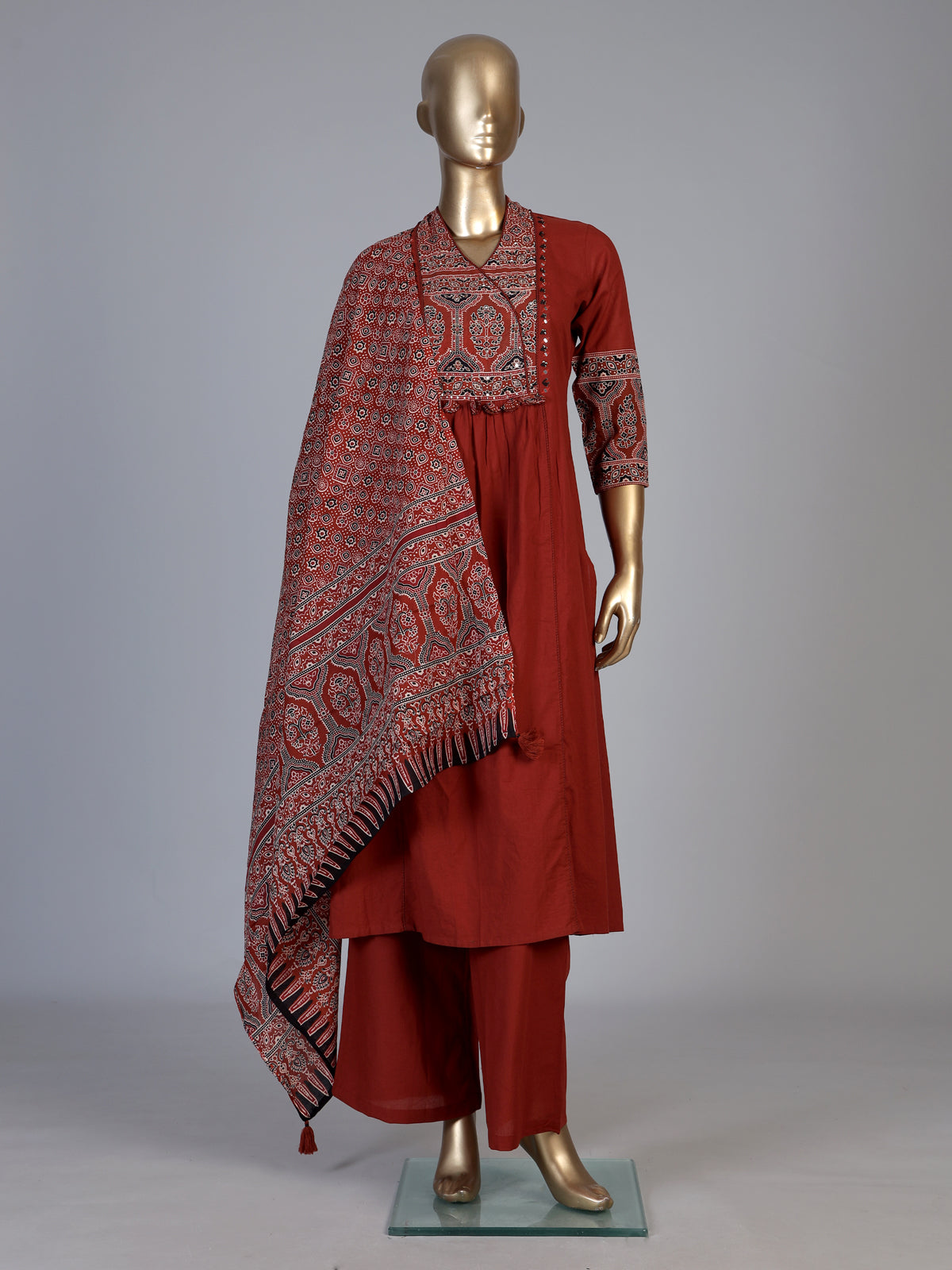 Rust red cotton blend anarkali kurti set with festive embellishments