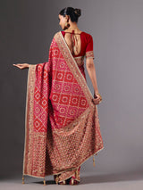 Rani pink georgette saree for wedding celebration