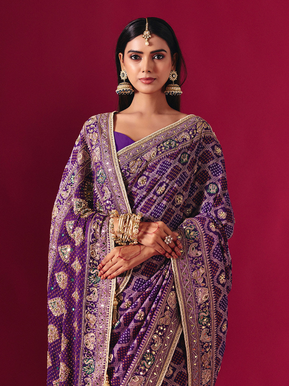 Purple georgette saree with elegant bandhani artistry