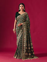 Green georgette saree with traditional handcrafted detailing