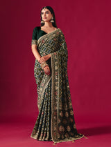 Green georgette saree with traditional handcrafted detailing