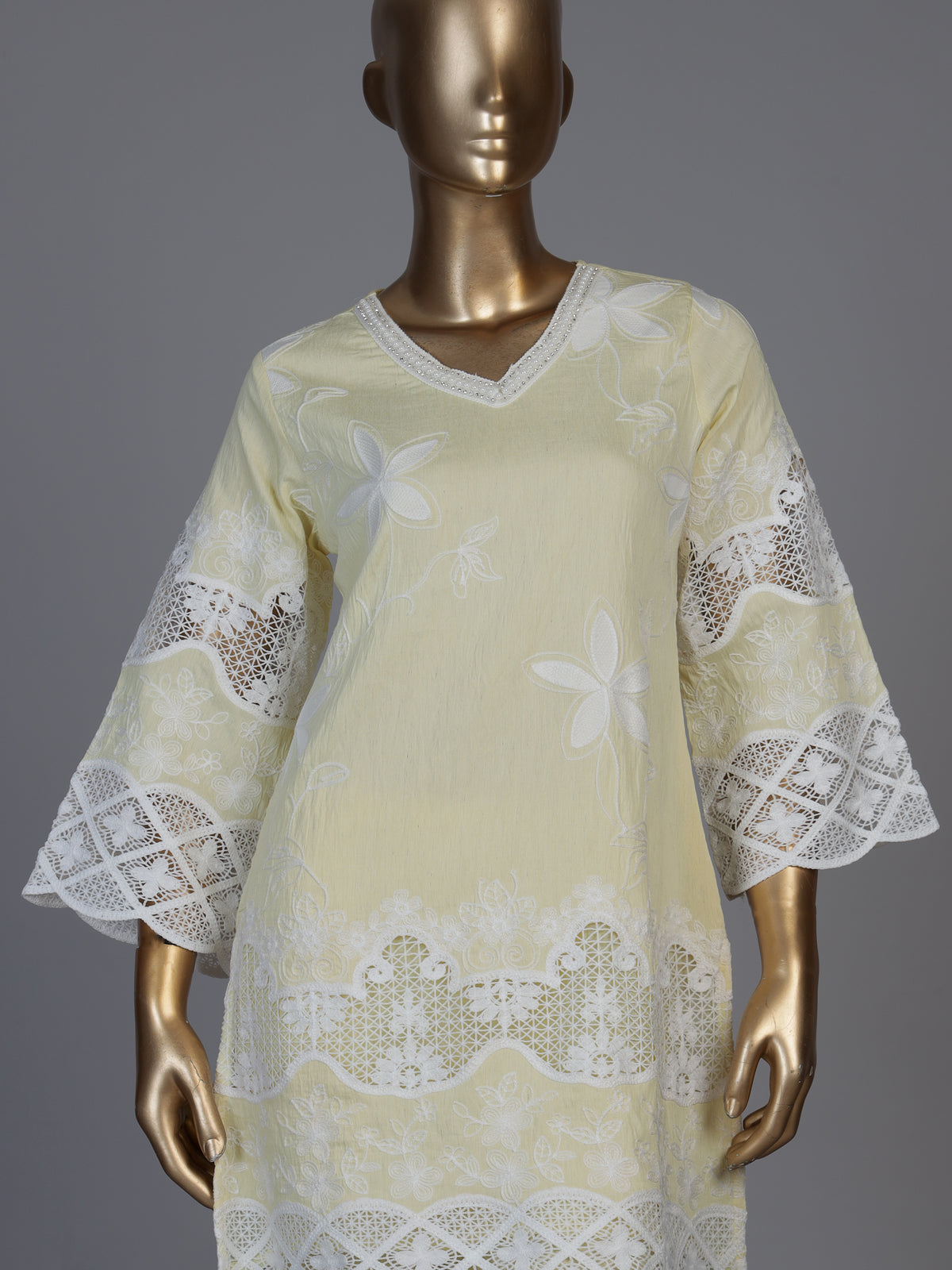 Radiant yellow cotton blend kurti set with pearls and cutwork