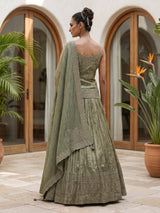 Green zardosi embellished women’s shimmer silk lehenga choli