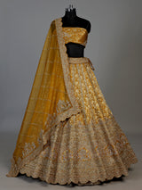 Mustard yellow cutdana zari embellished women’s raw silk lehenga choli