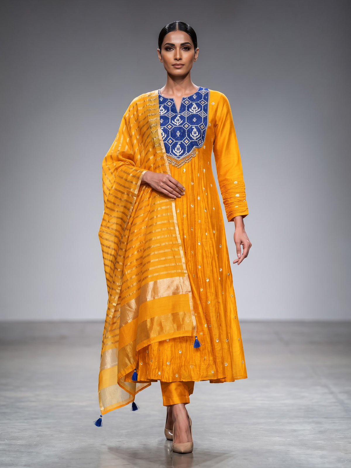 Mustard yellow silk anarkali suit with embellished dupatta
