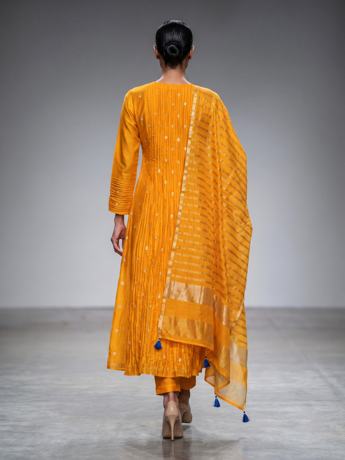 Mustard yellow silk anarkali suit with embellished dupatta