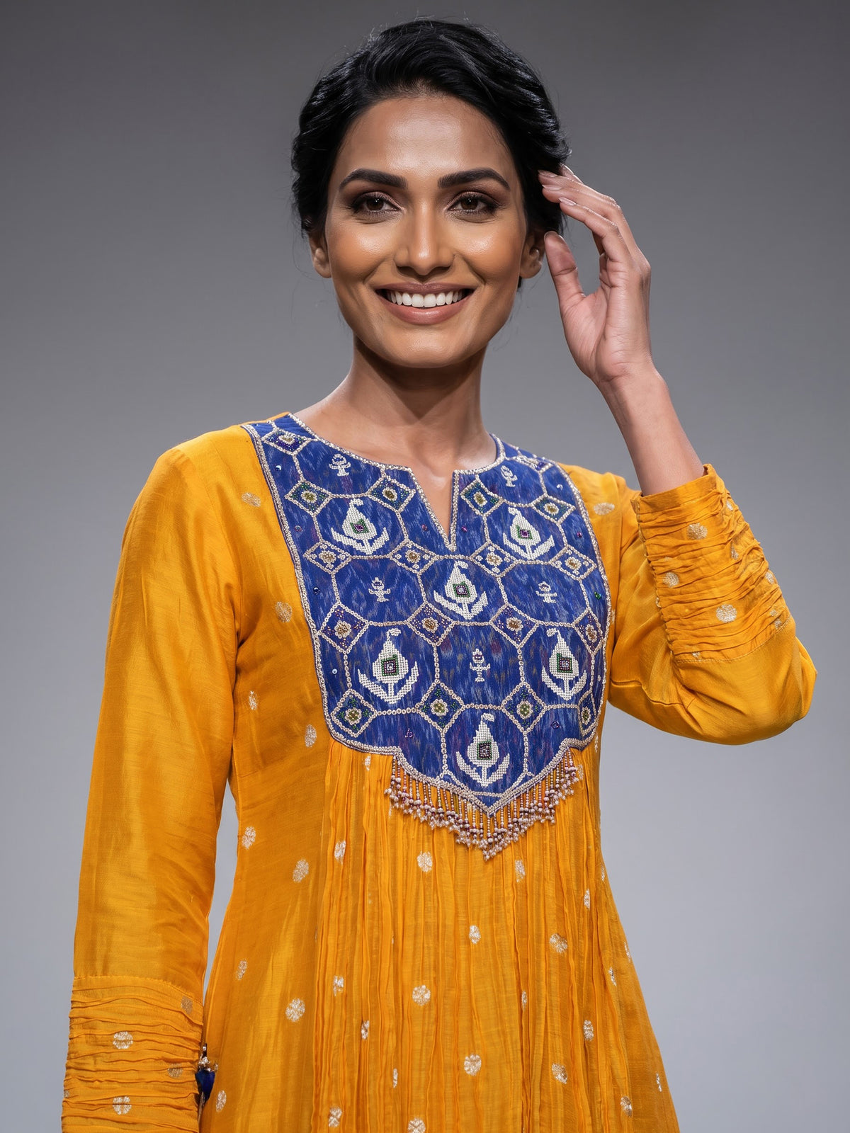 Mustard yellow silk anarkali suit with embellished dupatta