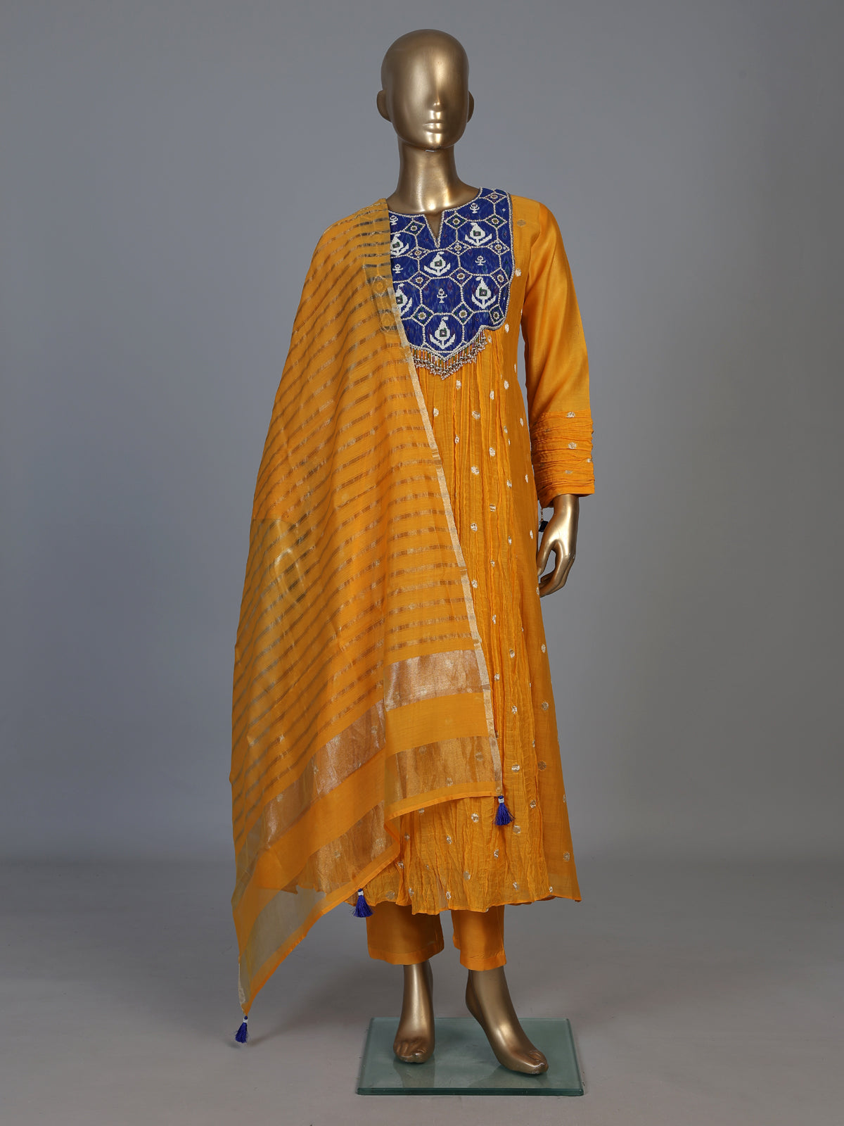 Mustard yellow silk anarkali suit with embellished dupatta