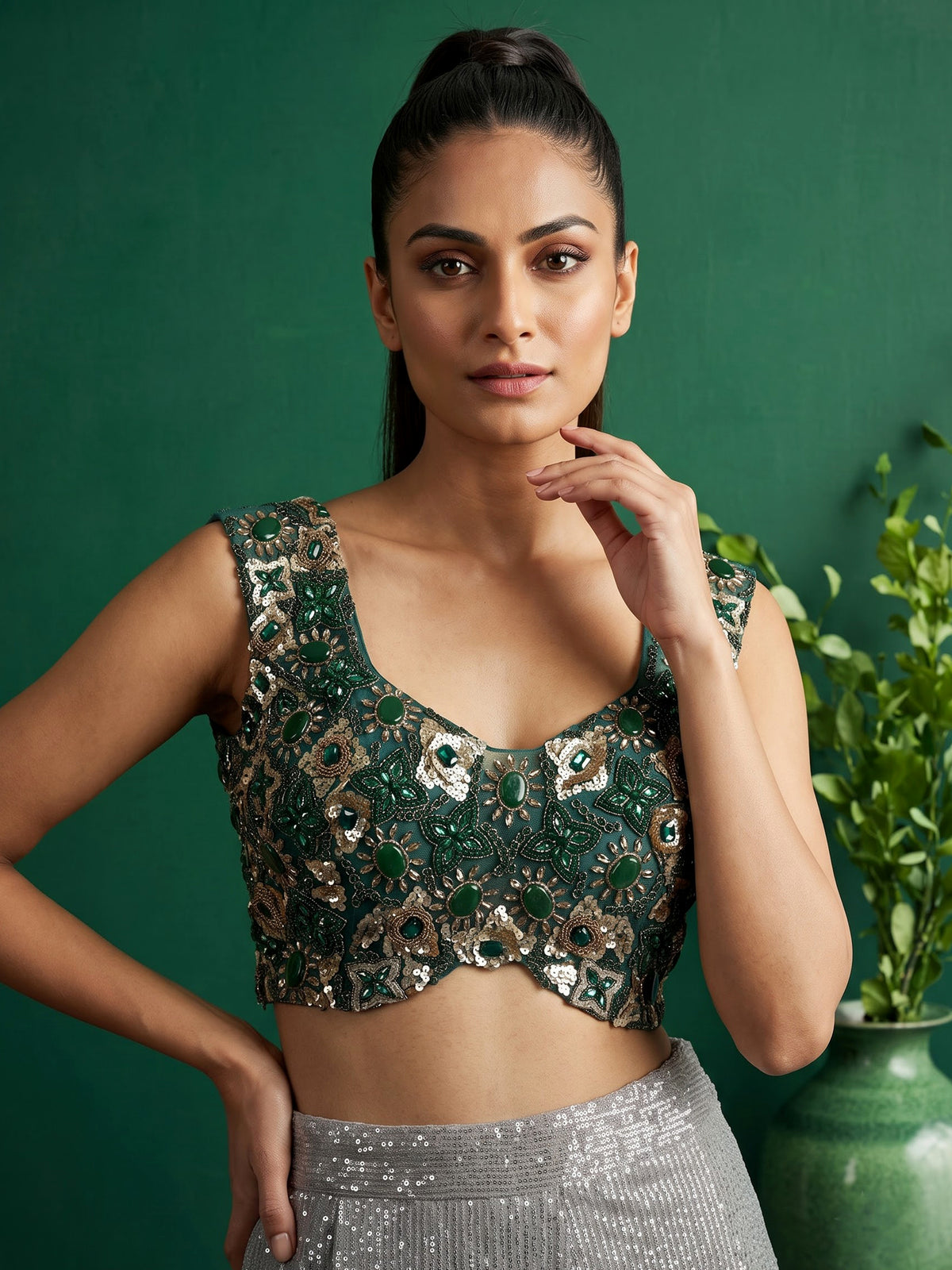 Green shaded sequin fabric saree with embellished tassel pallu