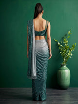 Green shaded sequin fabric saree with embellished tassel pallu