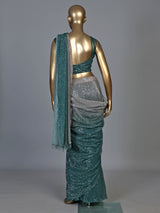 Green shaded sequin fabric saree with embellished tassel pallu