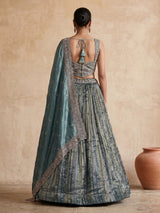 Pastel green tissue silk lehenga choli with festive embellishments
