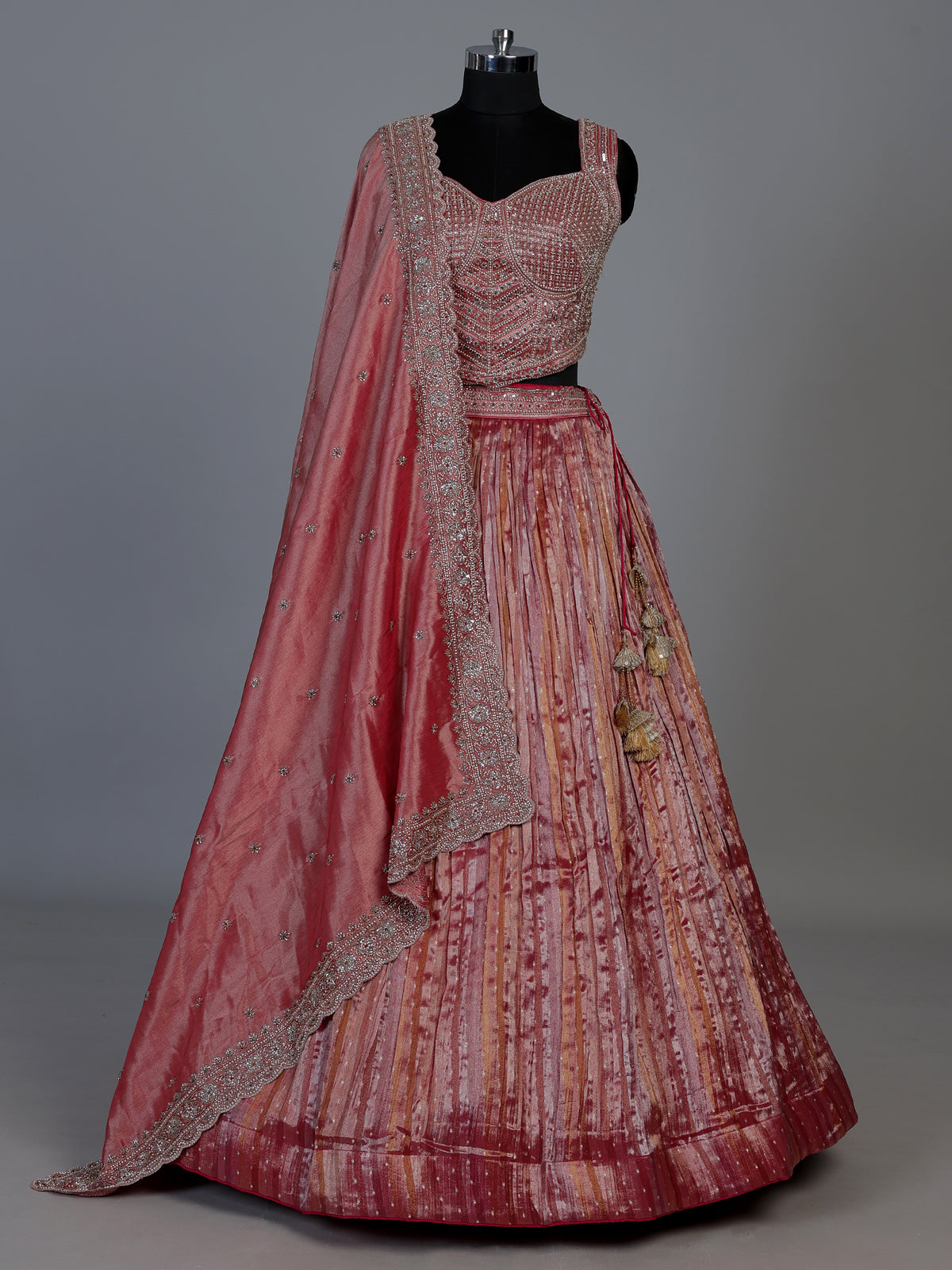 Pastel pink tissue silk lehenga choli with embellished dupatta