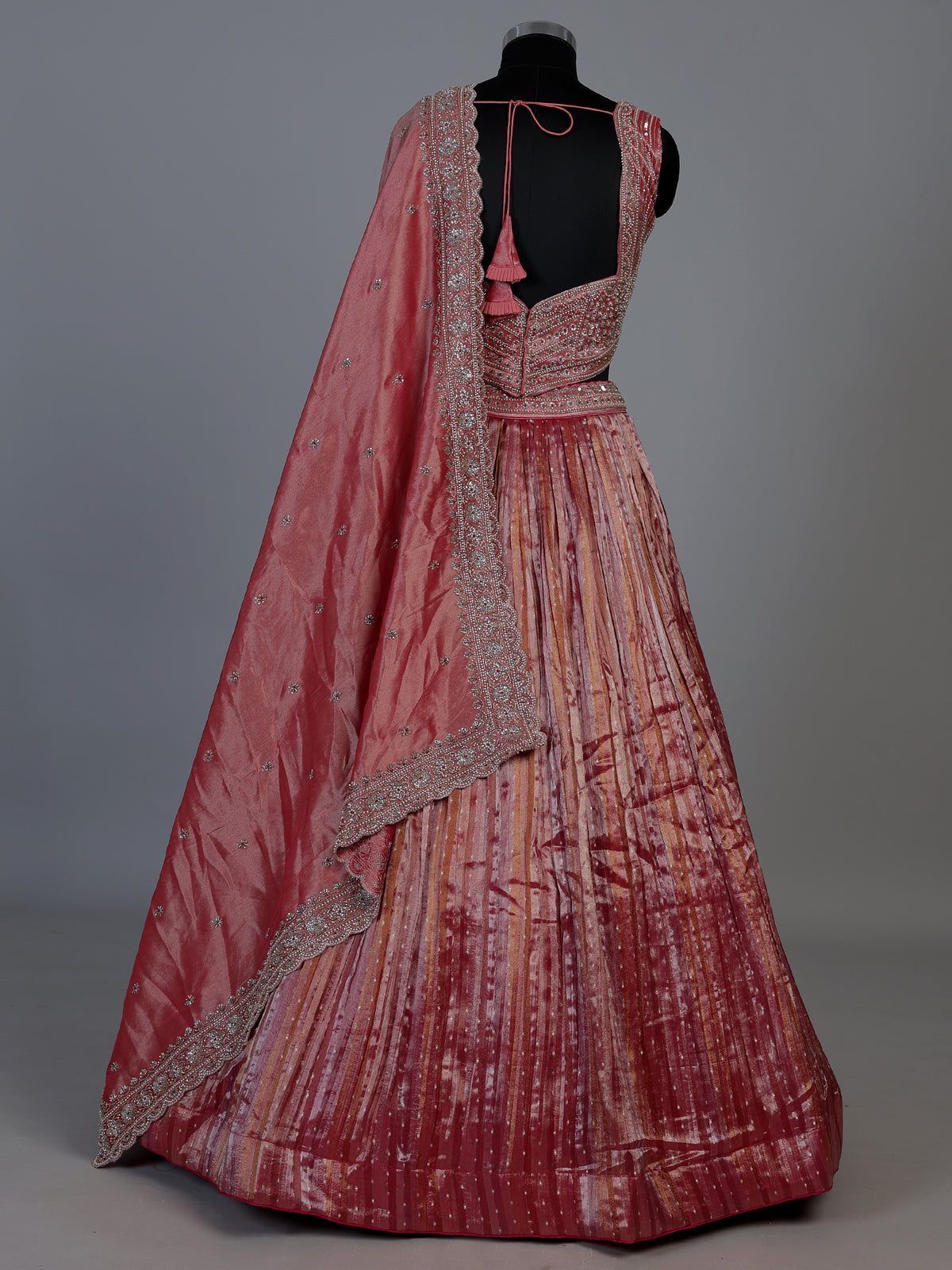 Pastel pink tissue silk lehenga choli with embellished dupatta