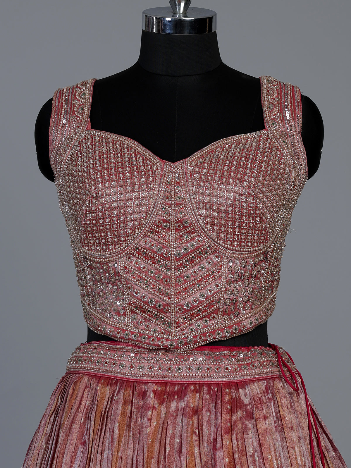Pastel pink tissue silk lehenga choli with embellished dupatta