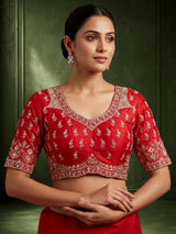 Cream and red bridal lehenga choli with jharokha work