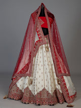 Cream and red bridal lehenga choli with jharokha work