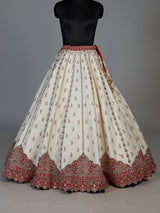 Cream and red bridal lehenga choli with jharokha work