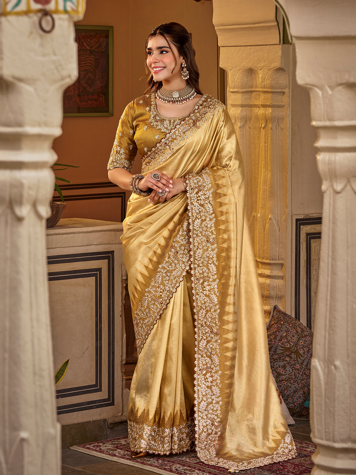 Golden yellow tissue silk women saree with rich detailing