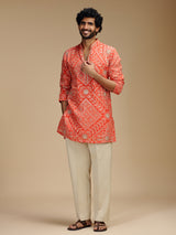 Orange art silk mens kurta suit with bandhani design