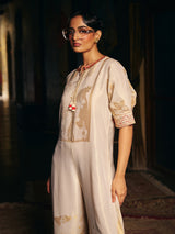 Cream womens designer silk jumpsuit with embroidered neckline
