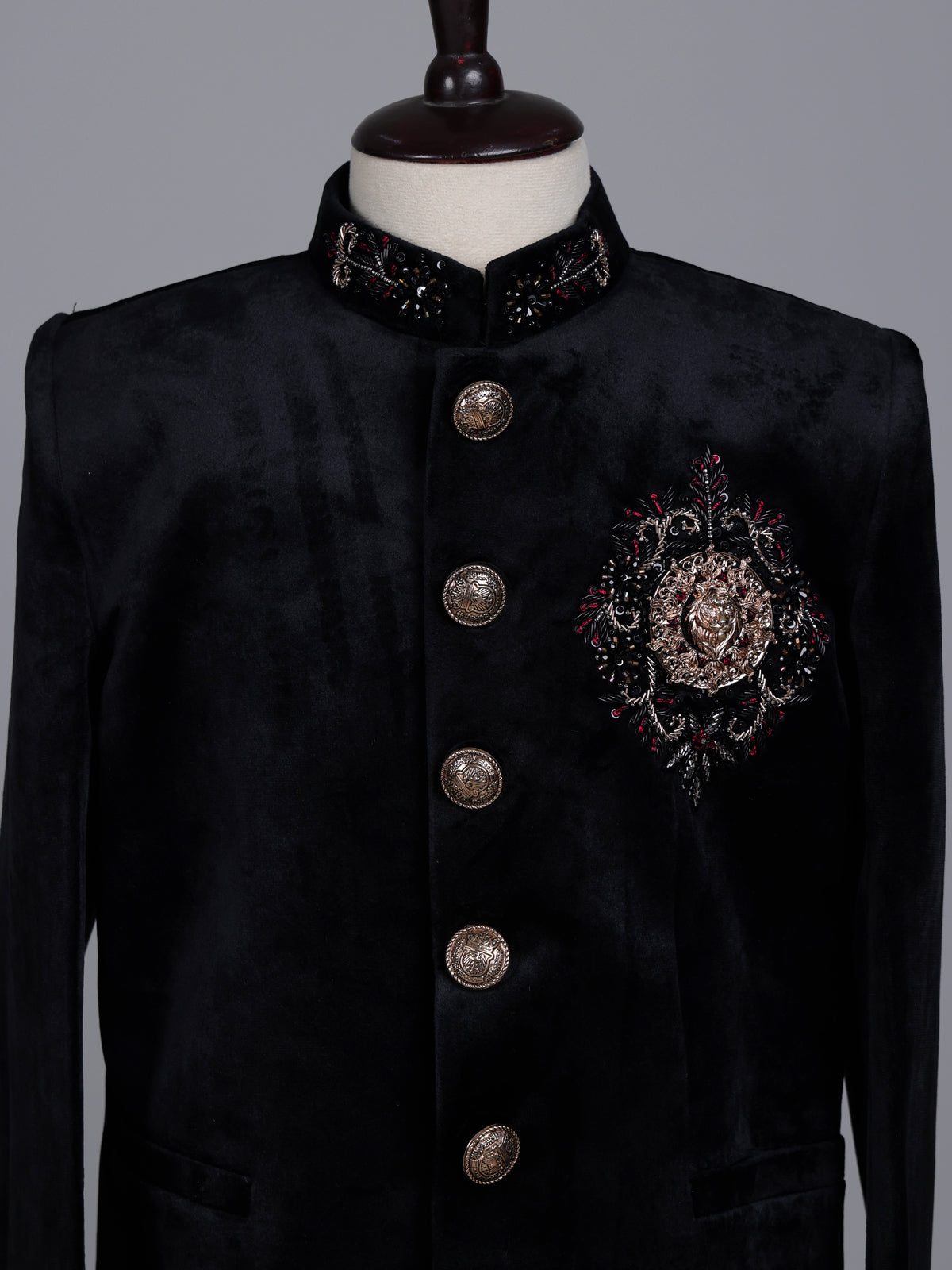 Black velvet boys jodhpuri suit with regal crest detailing