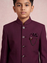 Wine boys jodhpuri suit with jacquard texture and metallic brooch